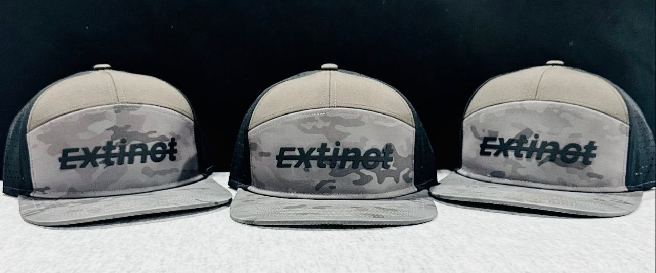 ExtinctMALE camo hat — three-hat lineup